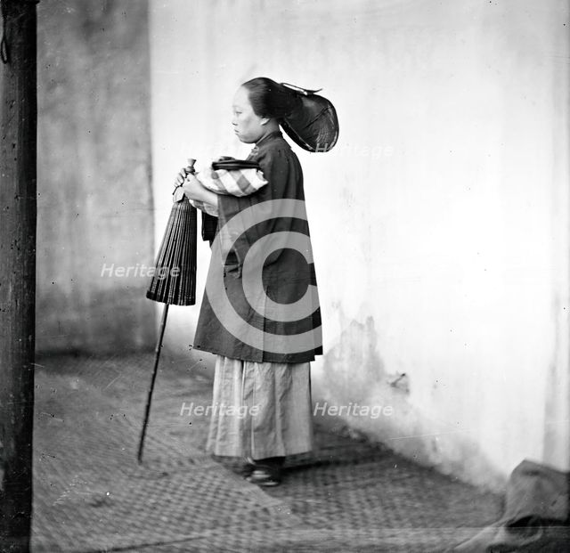 Canton, Kwangtung province, China: a lady holding a parasol, 1869. Creator: John Thomson.