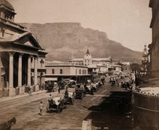 Cape Town, South Africa: horses and carriages on Adderley Street, with Table Mountain..., 1896. Creator: George Washington Wilson