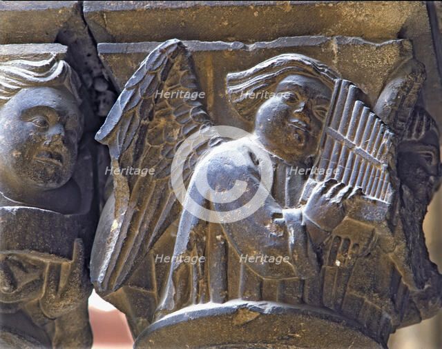 Capital of one of the Gothic galleries of the cloister built between (1387 - 1401) representing a…