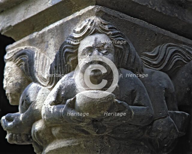 Capital of one of the Gothic galleries of the cloister built between 1387-1401. Female figure wit…