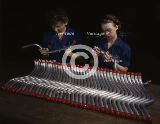 Capping and inspecting tubing: two women are shown...at Vultee's Nashville division, Tennessee, 1943 Creator: Alfred T Palmer.