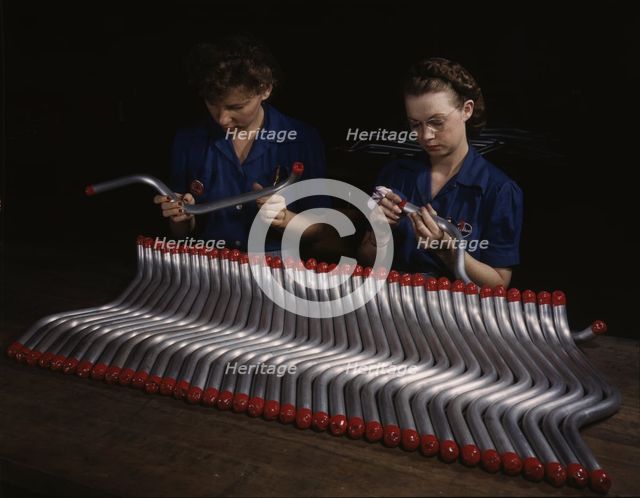 Capping and inspecting tubing: two women are shown...at Vultee's Nashville division, Tennessee, 1943 Creator: Alfred T Palmer.