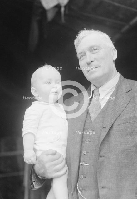 Captain Everett Edwards and baby, portrait photograph, 1933. Creator: Arnold Genthe.