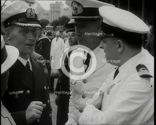 Captain Hans Langsdorff of the German Battleship Graf Spee Talking With Other Naval Officers, 1939. Creator: British Pathe Ltd.
