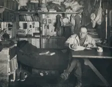Captain Scott Writing His Diary in the Hut at Cape Evans c1911, (1914). Creator: Herbert Ponting