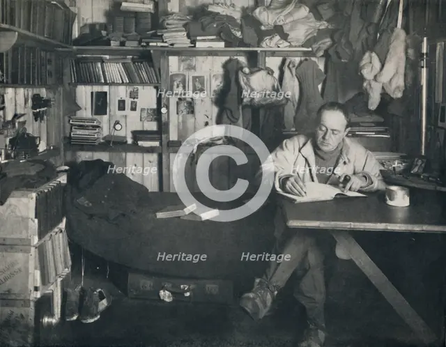 'Captain Scott Writing His Diary in the Hut at Cape Evans', c1911, (1914). Creator: Herbert Ponting.