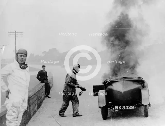 Car on fire, Brooklands, Surrey, 1928. Artist: Unknown