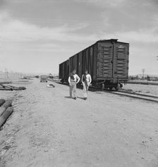 Car on siding across tracks from pea packing plant, Calipatria, Imperial Valley, 1939. Creator: Dorothea Lange