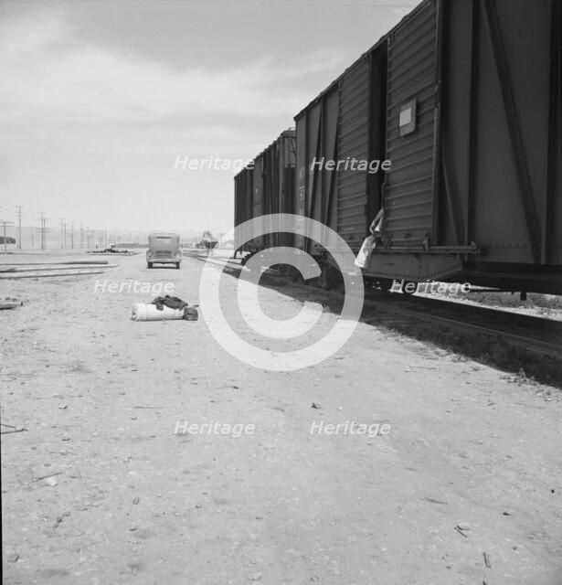 Car on siding across tracks from pea packing plant, Calipatria, Imperial Valley, 1939. Creator: Dorothea Lange.