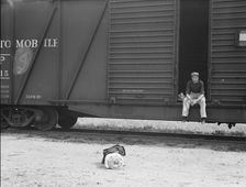 Car on siding across tracks from pea packing plant, Calipatria, Imperial Valley, 1939. Creator: Dorothea Lange