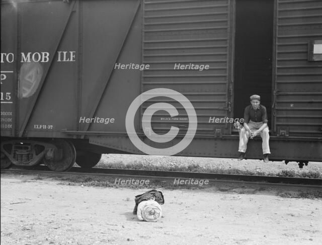 Car on siding across tracks from pea packing plant, Calipatria, Imperial Valley, 1939. Creator: Dorothea Lange.