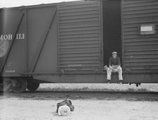 Car on siding across tracks from pea packing plant, Calipatria, Imperial Valley, 1939. Creator: Dorothea Lange