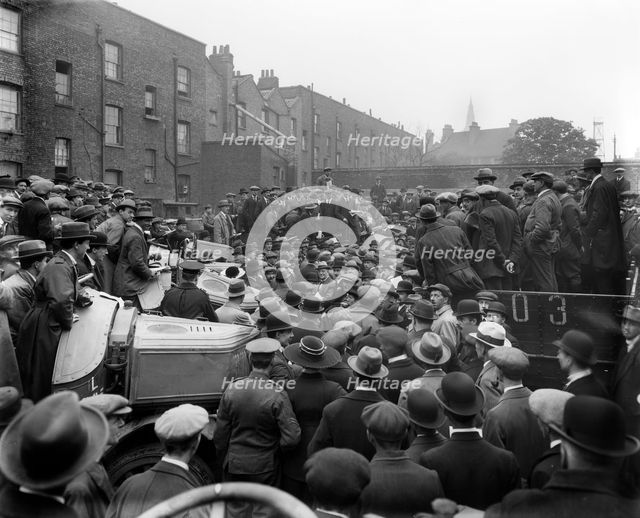 Car auction in Brixton Road, Brixton, London, 1919. Artist: Bedford Lemere and Company
