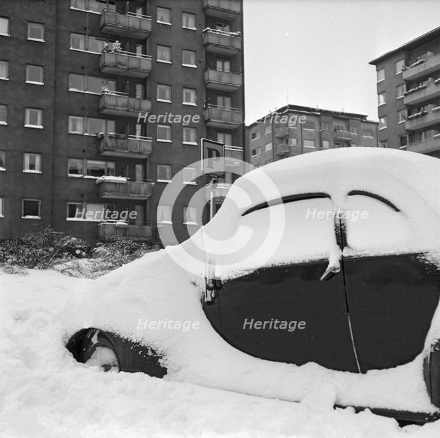 Car covered in snow, Stockholm, January 1954.
 Creator: Unknown.