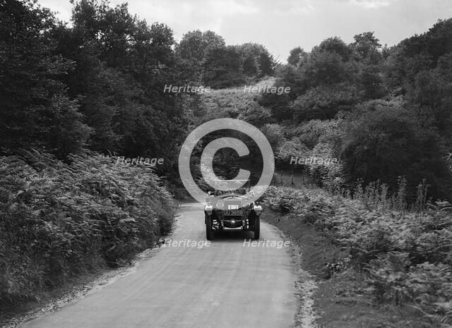 Car taking part in a First Aid Nursing Yeomanry trial or rally, 1931. Artist: Bill Brunell.