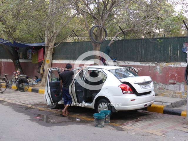 Car washing in Delhi. Creator: Unknown.