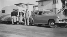 Car with caravan, Mooloolaba, Queensland, 1952. Creator: Jack Bain