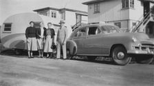 Car with caravan, Mooloolaba, Queensland, 1952. Creator: Jack Bain