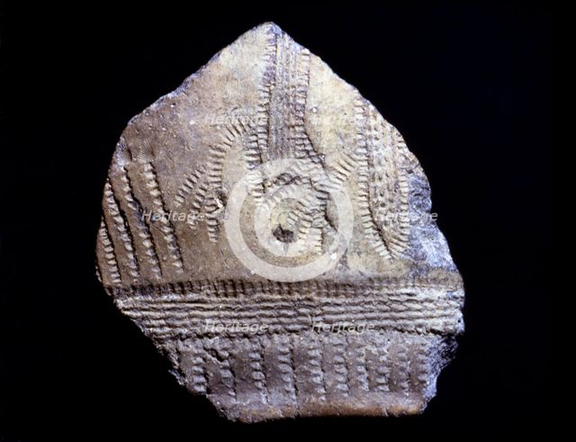 Cardium pottery fragment with anthropomorphic figures, they seem two persons with arms raised as …