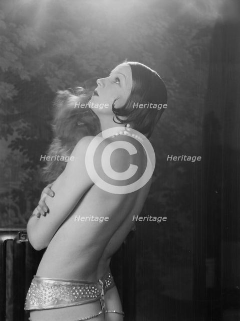 Carise, Erna, Mme., with dog, portrait photograph, 1928 Creator: Arnold Genthe.