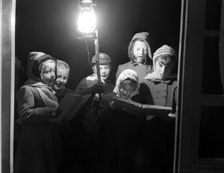 Carol singers, c1955. Creator: Arthur Charles Kirby Ware