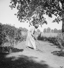 Caroline Atwater, wife of Negro owner, has a well-swept yard, 1939. Creator: Dorothea Lange