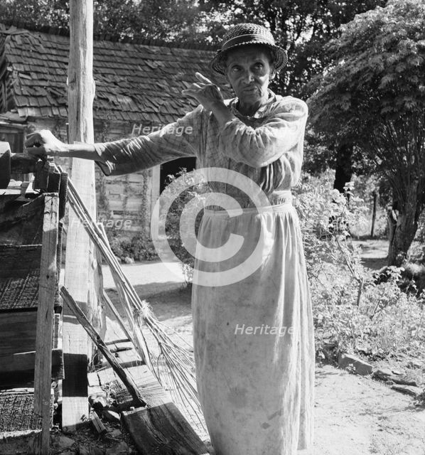 Caroline Atwater, wife of Negro owner, tells how they got their place, 1939. Creator: Dorothea Lange.