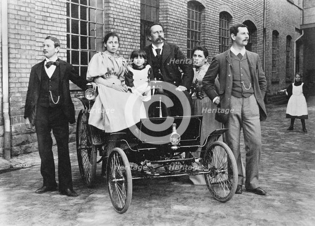 Carl Benz with his family at his Benz Velo in the Mannheim factory yard, 1894. Creator: Anonymous.