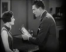 Carl Brisson and Lilian Hall-Davis Acting in a Scene. Carl Brisson is Holding a Framed..., 1920s. Creator: British Pathe Ltd