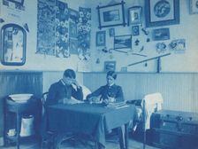 Carlisle Indian School, Carlisle, Pa. Two boys studying in dormitory room, 1901. Creator: Frances Benjamin Johnston