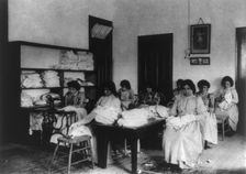 Carlisle Indian School, Carlisle, Pa. Clothes mending class, 1901. Creator: Frances Benjamin Johnston