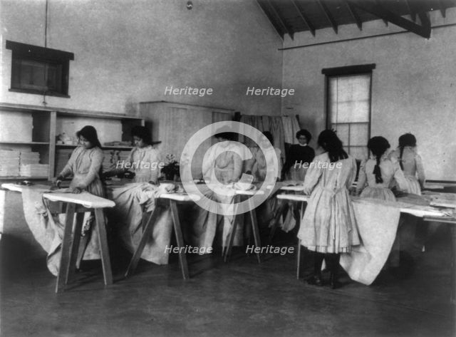 Carlisle Indian School, Carlisle, Pa. Ironing class, 1901. Creator: Frances Benjamin Johnston.