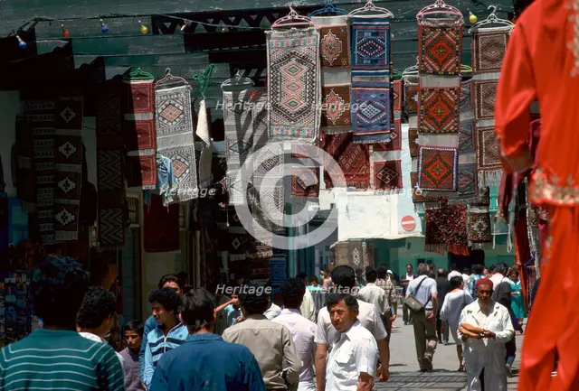 Carpets in the souk in Kairouan. Artist: Unknown