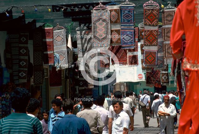 Carpets in the souk in Kairouan. Artist: Unknown