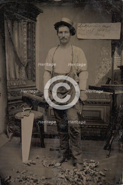 Carpenter or Cabinetmaker Standing Before a Sign Advertising His Trade, 1860s-80s. Creator: Unknown.