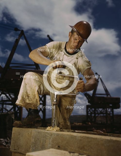 Carpenter at work on Douglas Dam, Tennessee (TVA), 1942. Creator: Alfred T Palmer.
