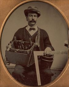 Carpenter Holding a Bag of Tools and a Square, 1880-90s. Creator: Unknown