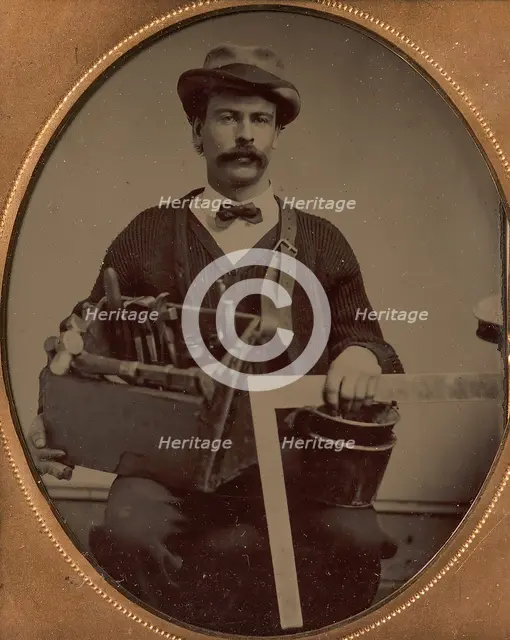 Carpenter Holding a Bag of Tools and a Square, 1880-90s. Creator: Unknown.