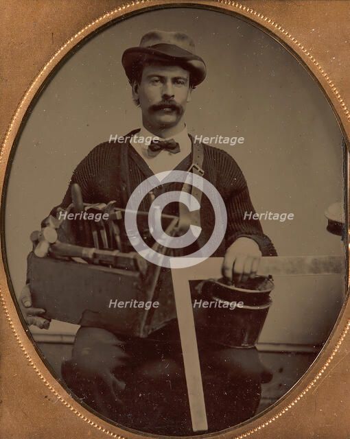 Carpenter Holding a Bag of Tools and a Square, 1880-90s. Creator: Unknown.