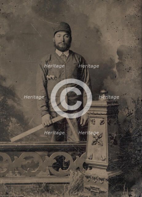 Carpenter, Standing Behind a Decorative Balustrade, Holding a Square, 1870s. Creator: Unknown.