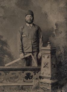 Carpenter, Standing Behind a Decorative Balustrade, Holding a Square, 1870s. Creator: Unknown