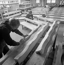 Carpenters working on church pews at a small carpentry workshop, South Yorkshire, 1969. Creator: Michael Walters