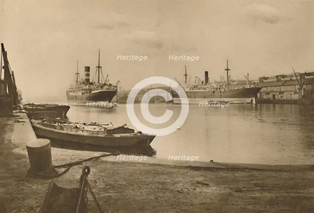 'Carriers of London's Food: Unloaded Cargo Boats in the South Dock of the West India Docks', c1935. Creator: Langfier.