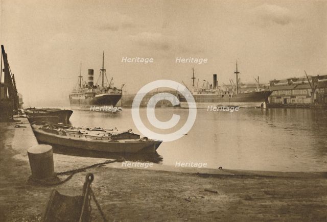 'Carriers of London's Food: Unloaded Cargo Boats in the South Dock of the West India Docks', c1935. Creator: Langfier.