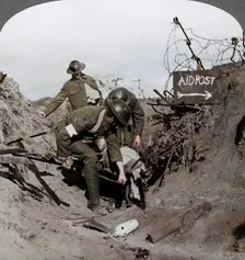 Carrying a wounded soldier to a first aid post, Passchendaele, Belgium, World War I, 1914-1918. Artist: Realistic Travels Publishers