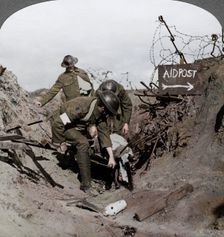 Carrying a wounded soldier to a first aid post, Passchendaele, Belgium, World War I, 1914-1918. Artist: Realistic Travels Publishers