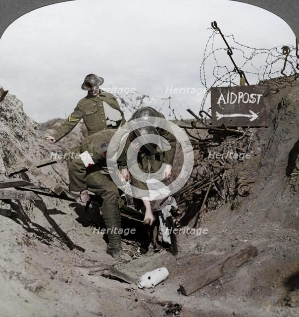 Carrying a wounded soldier to a first aid post, Passchendaele, Belgium, World War I, 1914-1918. Artist: Realistic Travels Publishers.