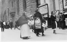 Carrying home Xmas baskets, between c1910 and c1915. Creator: Bain News Service
