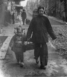 Carrying New Year's presents, Chinatown, San Francisco, between 1896 and 1906. Creator: Arnold Genthe