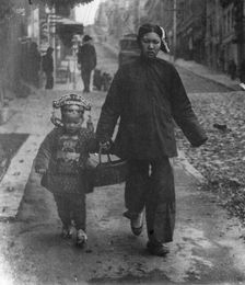 Carrying New Year's presents, Chinatown, San Francisco, between 1896 and 1906. Creator: Arnold Genthe